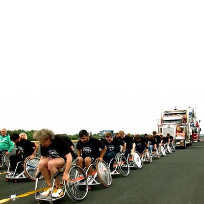 Heaviest vehicle pulled over 100 m by a wheelchair team