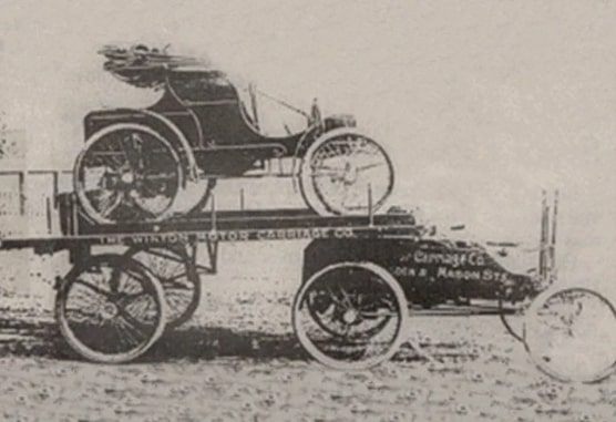 The first semi-truck hauling a car in 1898. Invented by Alexander Winton